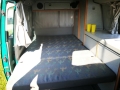 BulliHoliday VW California mieten Helga - ausgeklapptes Bett unten